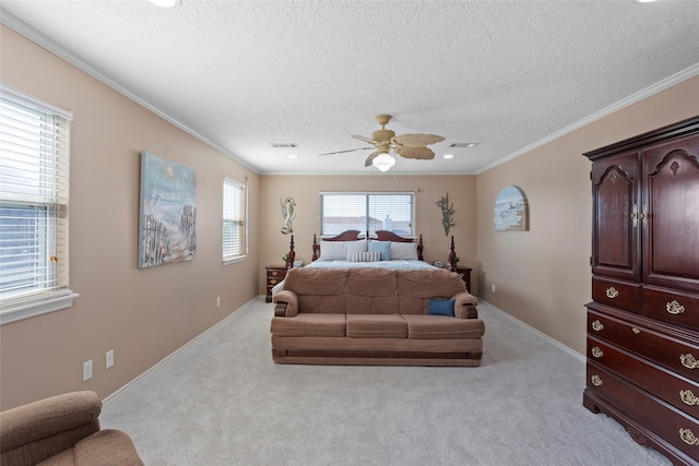 carpeted bedroom with crown molding, a textured ceiling, and ceiling fan