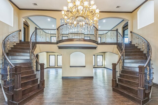 24578 Derry St, Hempstead, TX 77445 - entryway with arched walkways, crown molding, stairway, baseboards, and wood finished floors