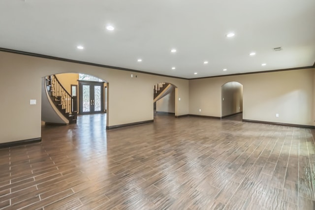 unfurnished room with ornamental molding, french doors, and dark hardwood / wood-style floors