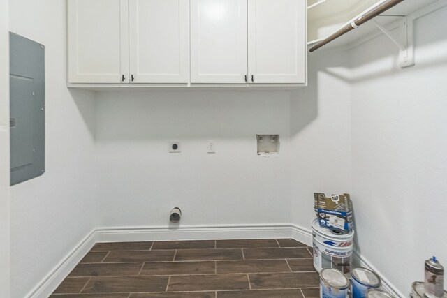 24578 Derry St, Hempstead, TX 77445 - laundry room featuring electric dryer hookup, baseboards, electric panel, and wood finish floors