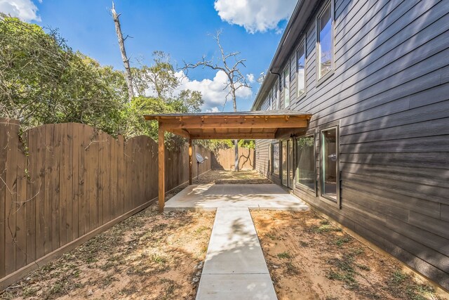 24578 Derry St, Hempstead, TX 77445 - fenced backyard featuring a patio area