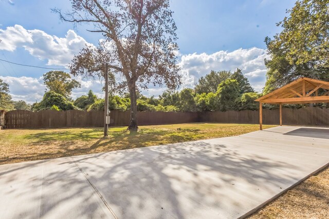 24578 Derry St, Hempstead, TX 77445 - view of patio with a gazebo, a carport, and concrete driveway