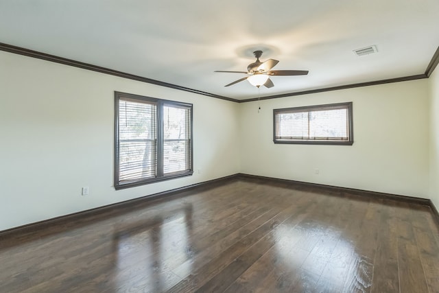 unfurnished room featuring ceiling fan, dark hardwood / wood-style floors, ornamental molding, and a healthy amount of sunlight