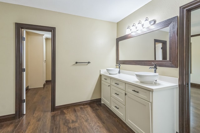 bathroom with hardwood / wood-style floors and vanity