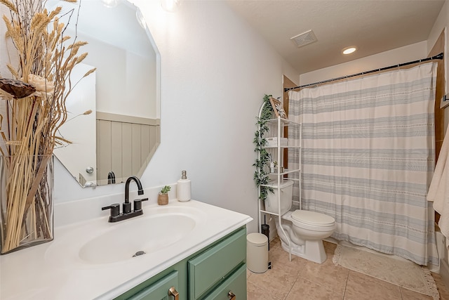 bathroom with a textured ceiling, toilet, tile patterned floors, a shower with curtain, and vanity