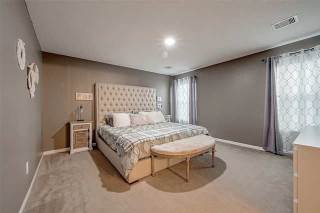 bedroom featuring light colored carpet