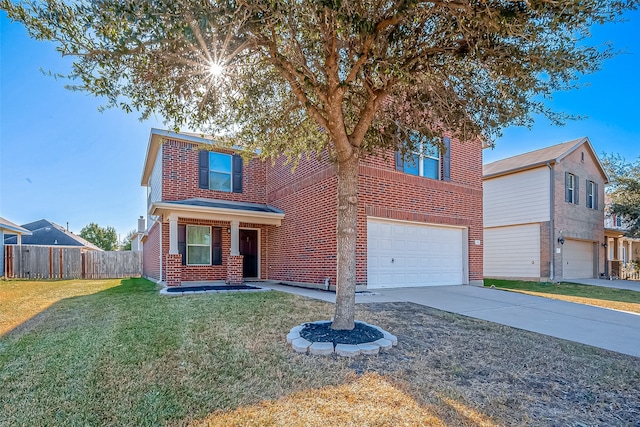 view of front of house featuring a garage and a front lawn