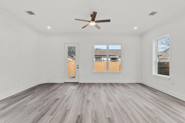 unfurnished room with ceiling fan, light wood-type flooring, plenty of natural light, and ornamental molding