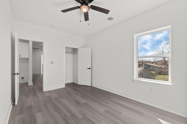 unfurnished bedroom featuring ceiling fan and hardwood / wood-style floors