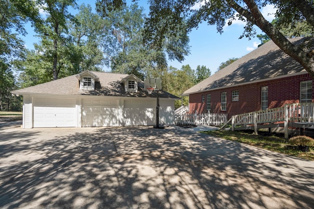 view of side of home with a garage