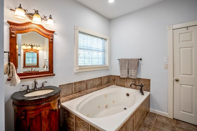 bathroom with a relaxing tiled tub and vanity