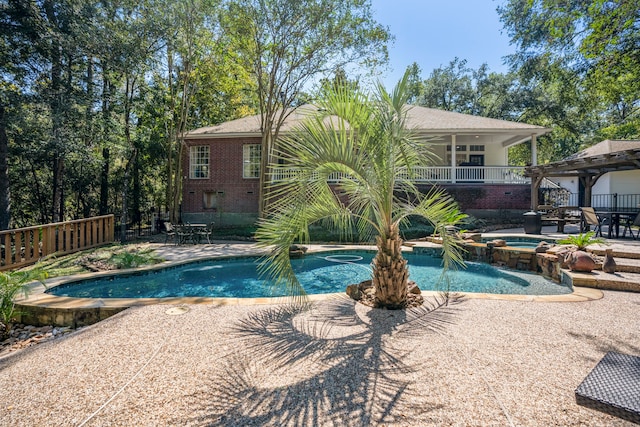 view of pool featuring an in ground hot tub and a patio