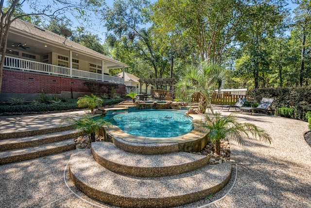 view of pool featuring a patio area, a pergola, and an in ground hot tub