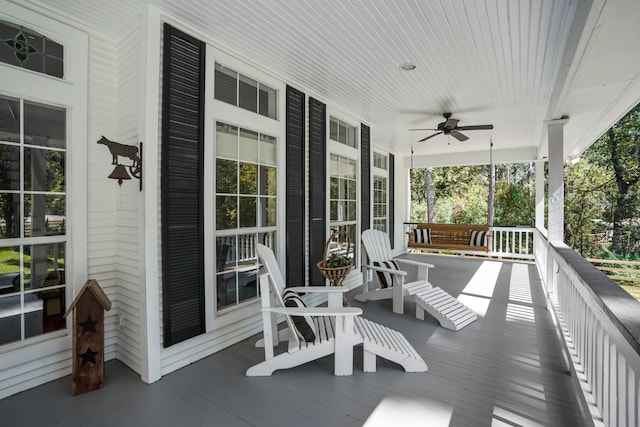 wooden terrace featuring ceiling fan