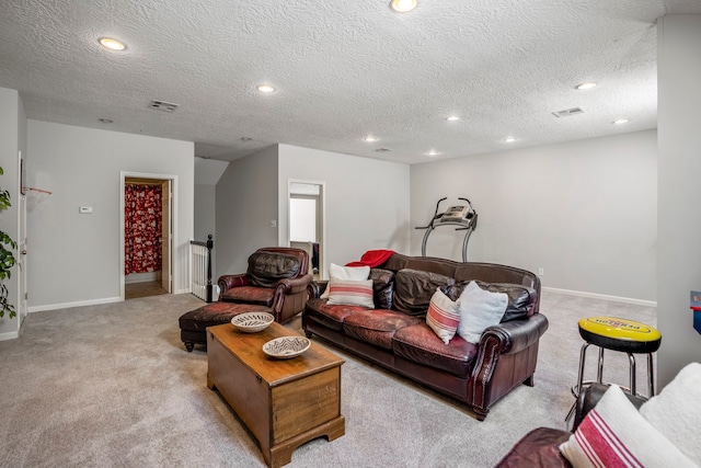 carpeted living room with a textured ceiling