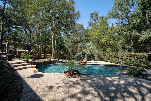 view of pool with an in ground hot tub and a pergola