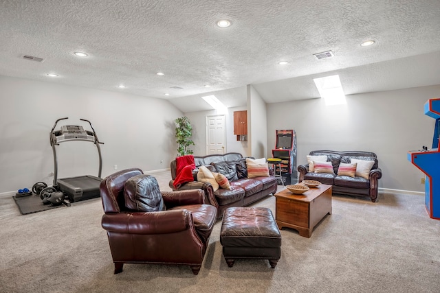 living room with vaulted ceiling, light colored carpet, and a textured ceiling