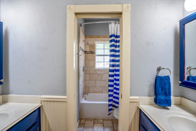 full bathroom with vanity, toilet, and shower / bathtub combination with curtain