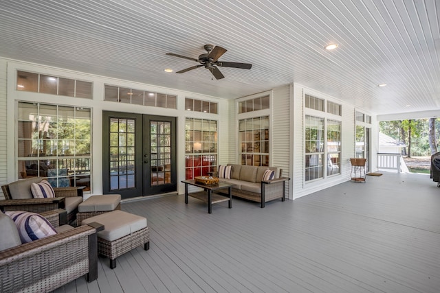 sunroom / solarium with ceiling fan, french doors, and wooden ceiling