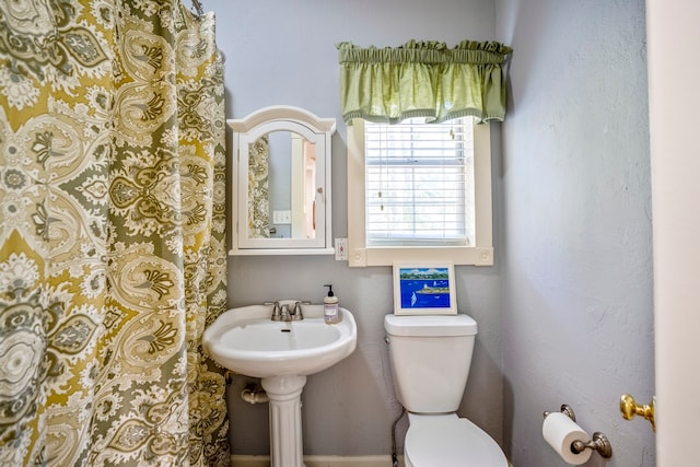 bathroom with toilet and sink