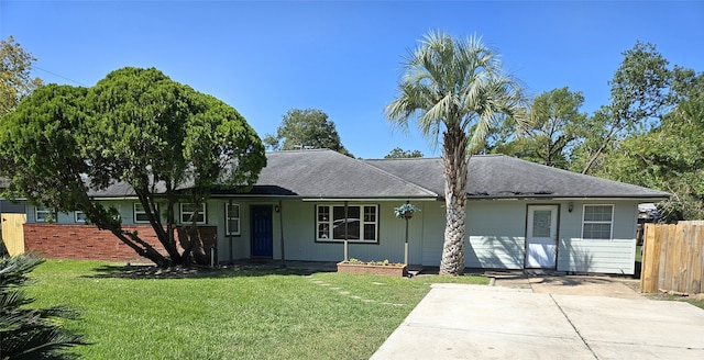 ranch-style house featuring a front lawn