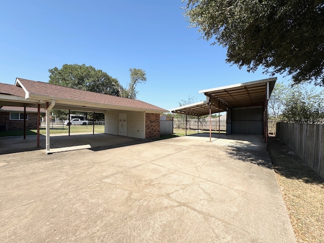 view of parking / parking lot featuring a carport