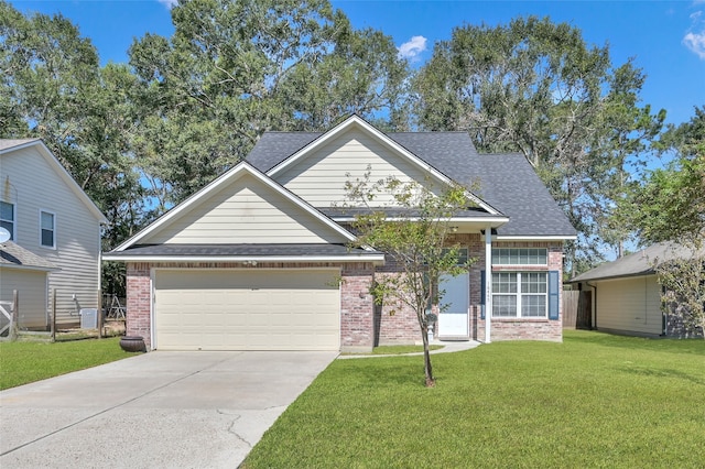 view of front of property featuring a front yard and a garage