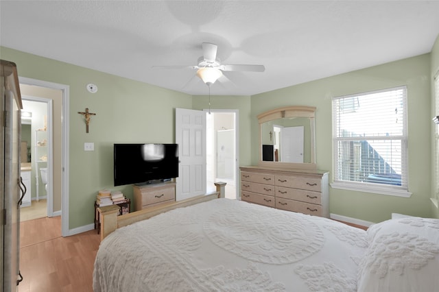 bedroom with light hardwood / wood-style floors and ceiling fan