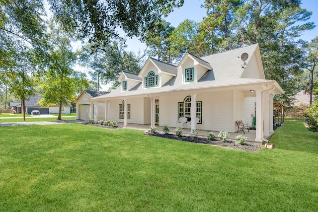 cape cod home featuring a front yard and a porch