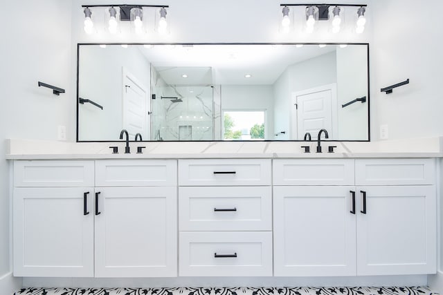 bathroom with vanity and a shower with shower door