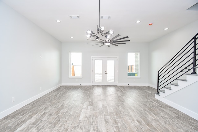 entryway with a notable chandelier and light hardwood / wood-style floors