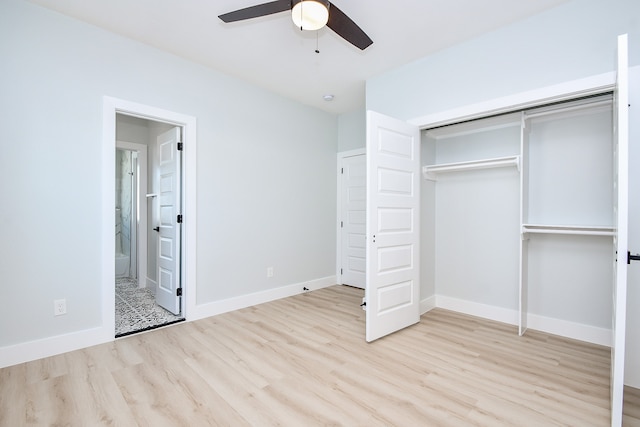 unfurnished bedroom with connected bathroom, light hardwood / wood-style flooring, a closet, and ceiling fan