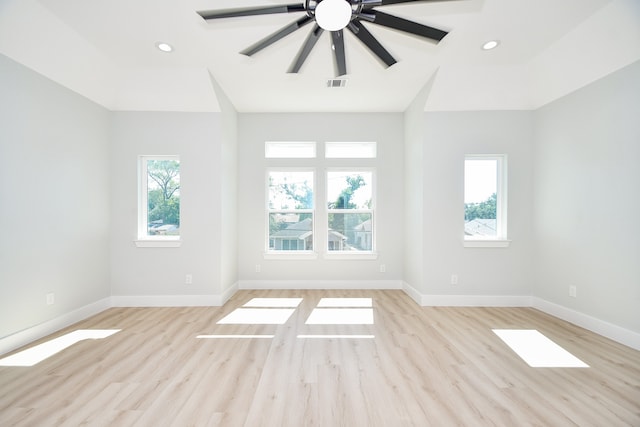 unfurnished room featuring light hardwood / wood-style floors and plenty of natural light