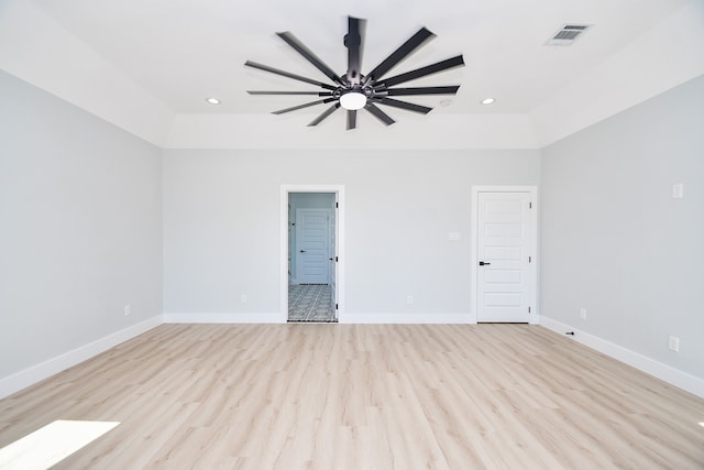 spare room with light hardwood / wood-style flooring and ceiling fan