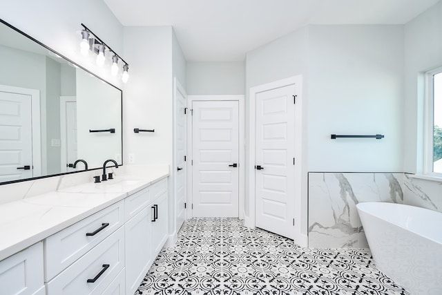 bathroom featuring vanity, a bathing tub, and tile walls