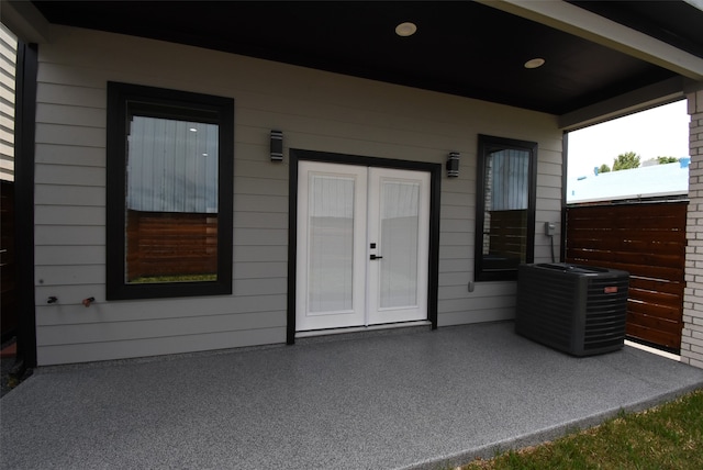 doorway to property with central AC unit