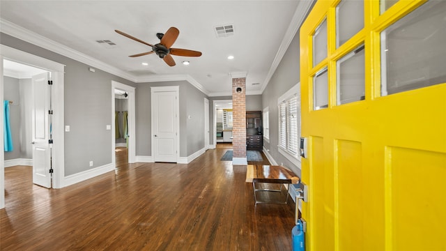 interior space featuring ornamental molding, decorative columns, ceiling fan, and dark wood-type flooring