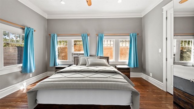 bedroom featuring ornamental molding, multiple windows, ceiling fan, and dark hardwood / wood-style floors