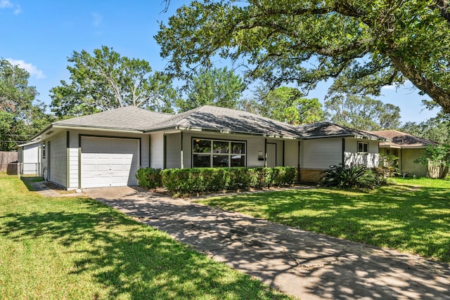 ranch-style home featuring a garage and a front yard