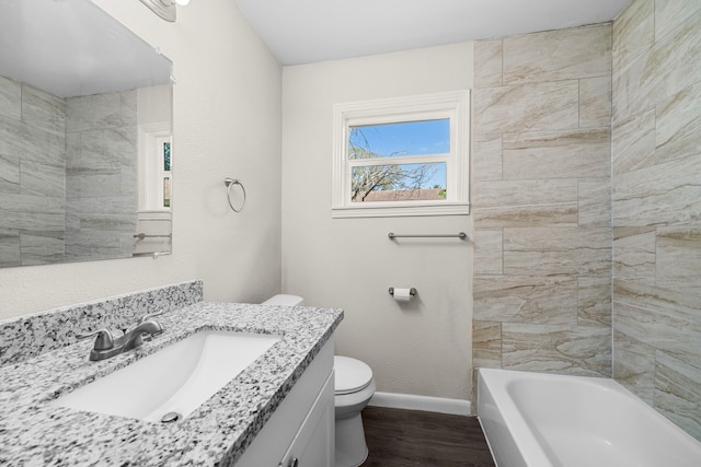 bathroom featuring hardwood / wood-style floors, toilet, and vanity