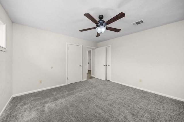 carpeted empty room with ceiling fan