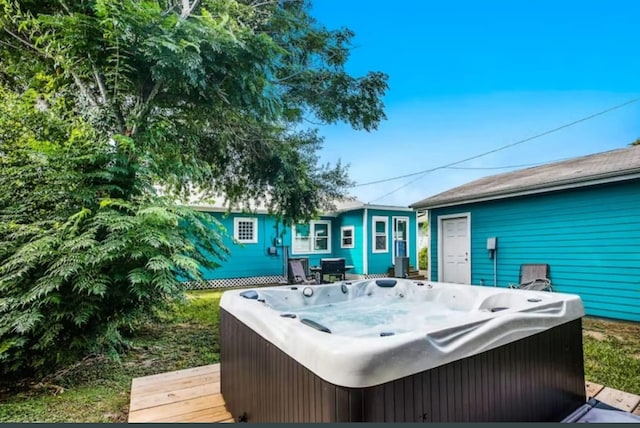 exterior space featuring a hot tub