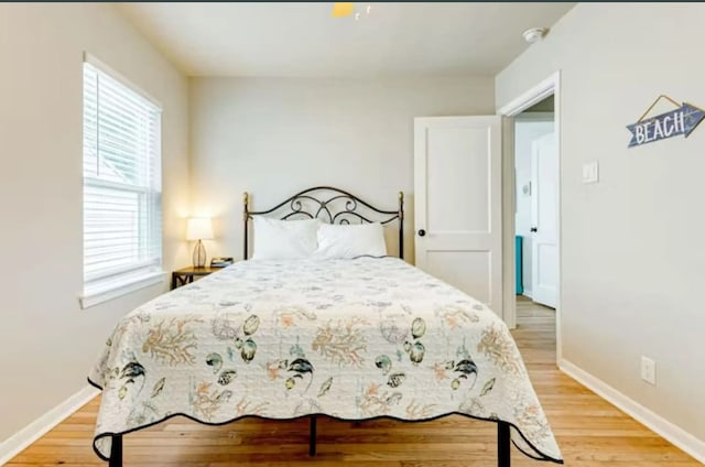 bedroom with light hardwood / wood-style flooring