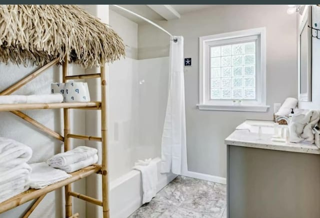 bathroom with vanity and shower / bathtub combination with curtain