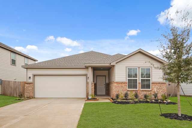 view of front of house with a garage and a front lawn