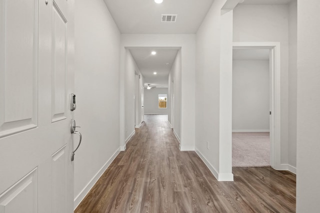 corridor featuring hardwood / wood-style flooring