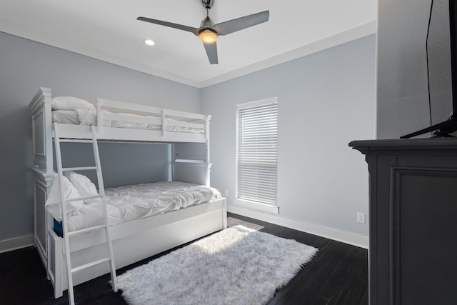 bedroom featuring dark hardwood / wood-style floors and ceiling fan