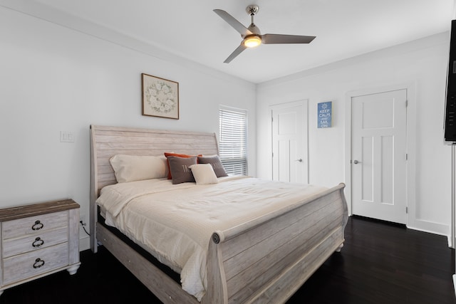 bedroom with ceiling fan and dark wood-type flooring