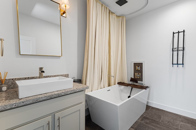 bathroom featuring vanity and a bathing tub