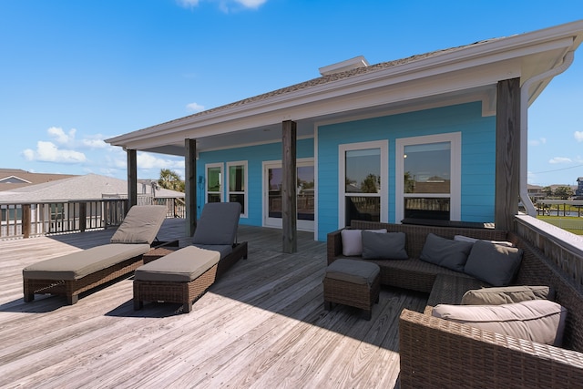 wooden terrace with outdoor lounge area